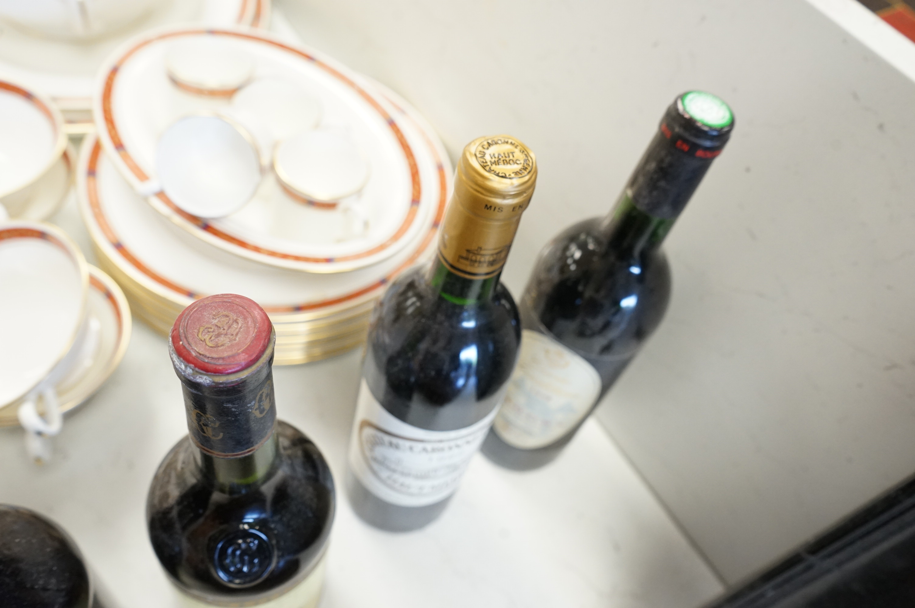 Eight bottles of red wine including three bottles of Chateau Talbot Saint Julien 1975, Chateauneuf du Pape 2008, Chateau Caronne Ste Gemme 1988 etc.